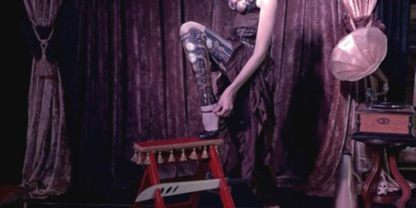 Woman-Walking-On-Knives-In-Steampunk-Show