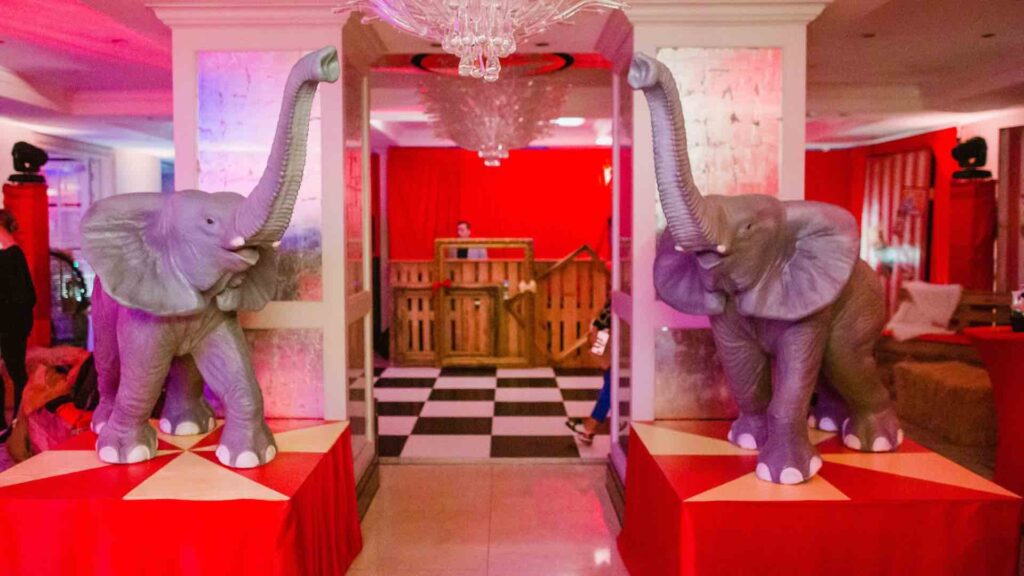 Circus event theming with two elephant props surrounding a doorway.