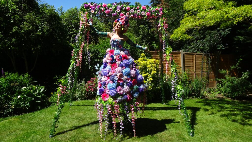 walkabout flower girl at corporate garden party ideal for summer event theming.