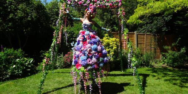 Floral-Stilt-Walker-At-Garden-Themed-Event