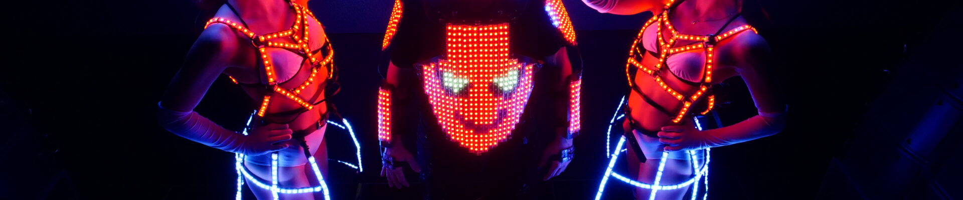 Glowing-DJ-To-Hire-With-LED-Dancers Glowing-DJ-To-Hire-With-LED-Dancers