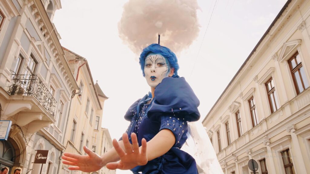 Cloud themed walkabout character wearing vibrant blue costume.