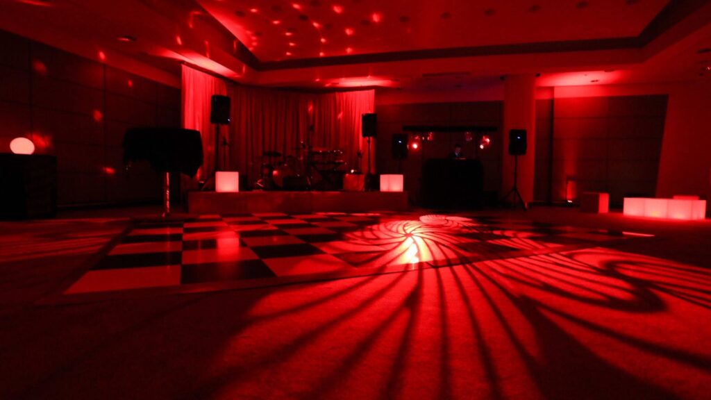 Red lit Las Vegas themed party space.