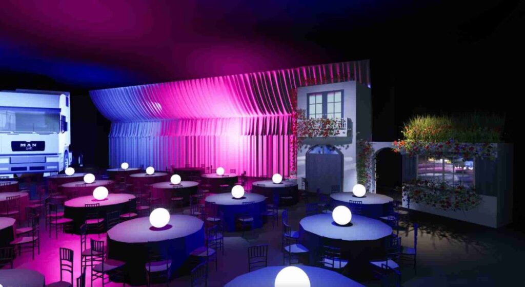 Mediterranean archway entrance set design with dining tables at around the world themed corporate gala event
