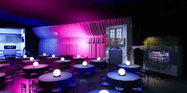 Mediterranean archway entrance and dining setup showcasing complete venue transformation for an around the world themed corporate gala