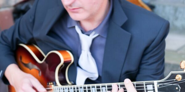 Bossa-Nova-Performer-To-Hire With-Guitar