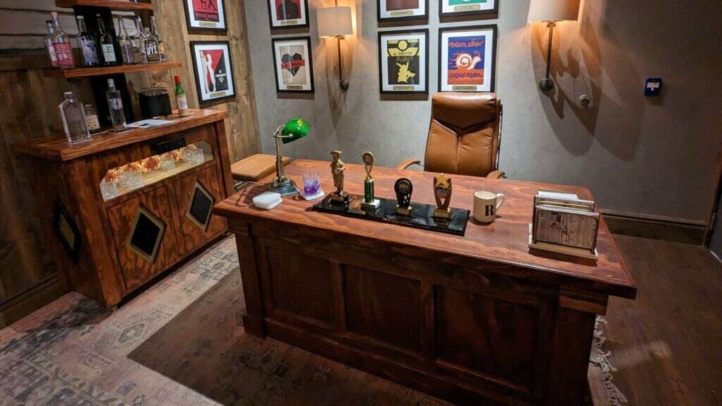 A desk and bar set up created as part of a custom corporate escape room design.