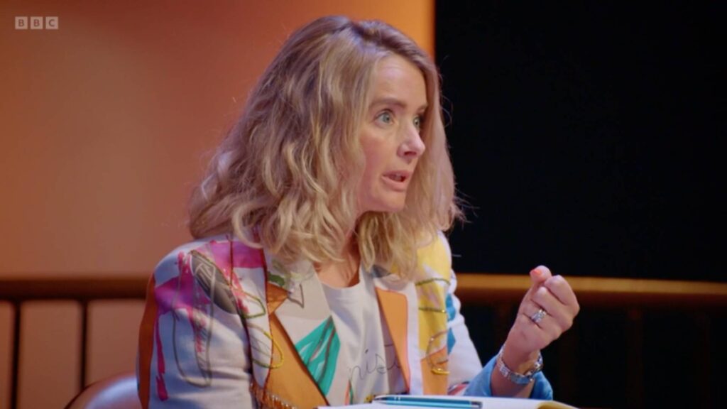 Julia Charles gives feedback to contestants on BBC The Apprentice about their Medieval Escape Game.