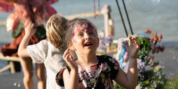 Girl-Playing-With-Bubbles