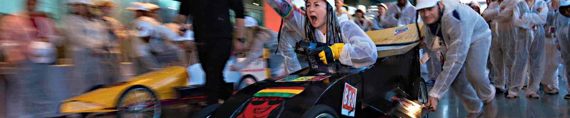 Employees-Enjoying-Formula-One-Team-Building-Challenge Employees-Enjoying-Formula-One-Team-Building-Challenge