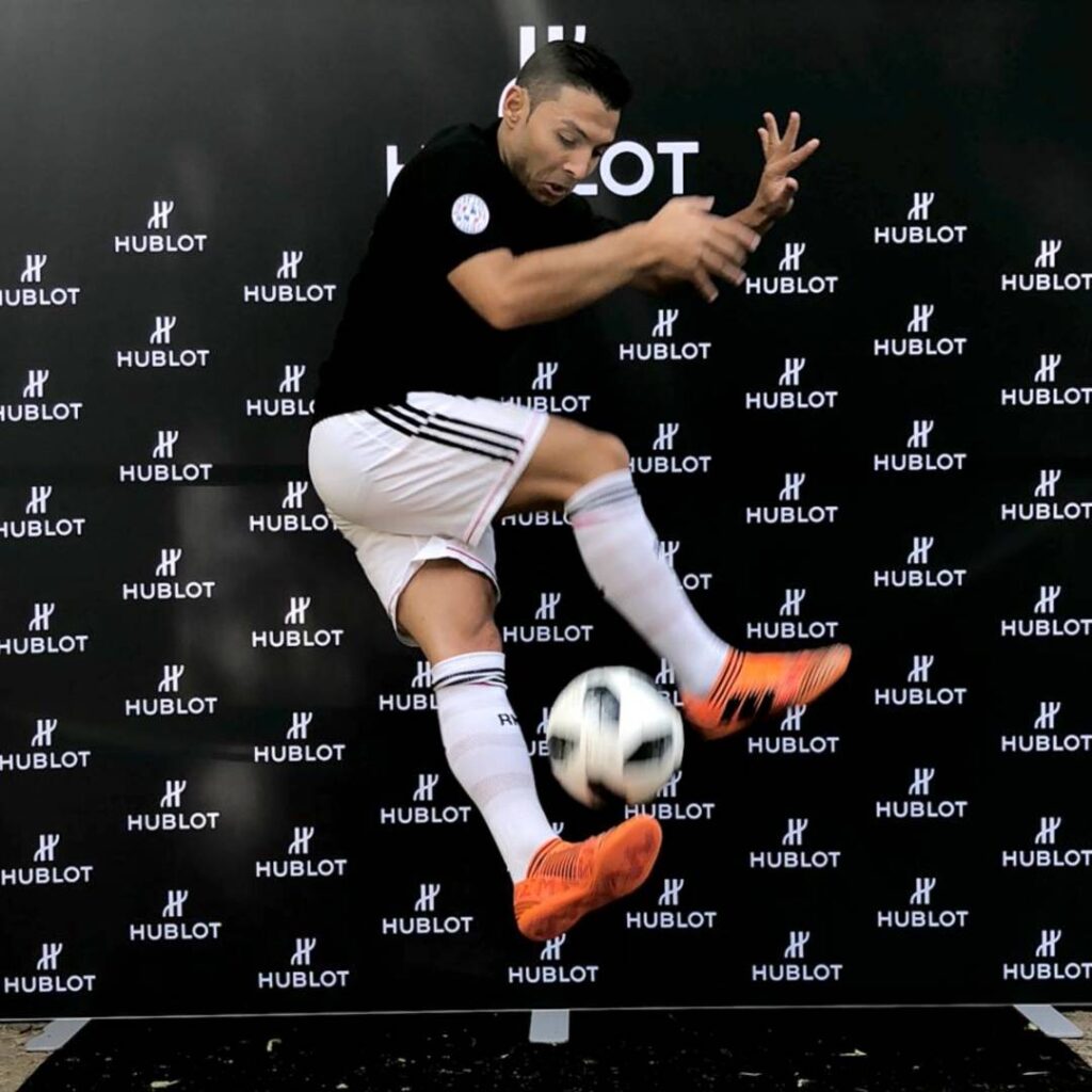 Ronaldo football freestyler lookalike performing a trick for brand activation.