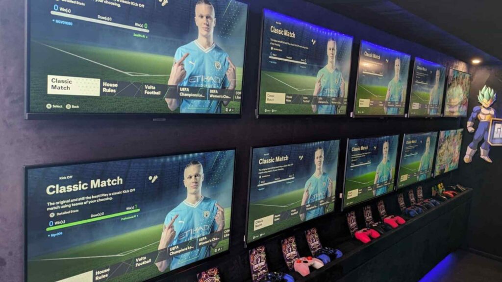 Interior of gaming truck showing wall of screens.