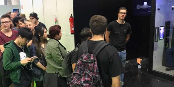 Guests-Queing-Up-To-Experience-Virtual-Reality-SR-Pod