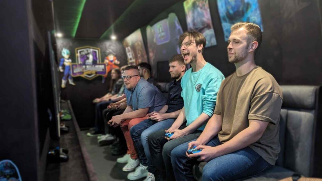 Group of event attendees playing games inside our mobile gaming van.