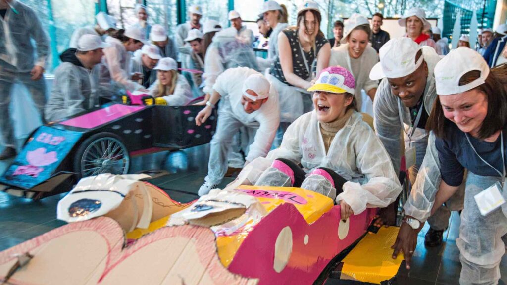 Lady inside Formula One Challenge at a Team Building Event.