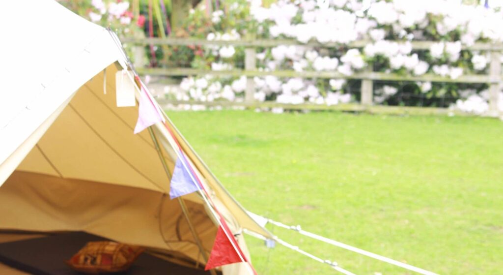 Hippy style teepee tent at a music themed festival.