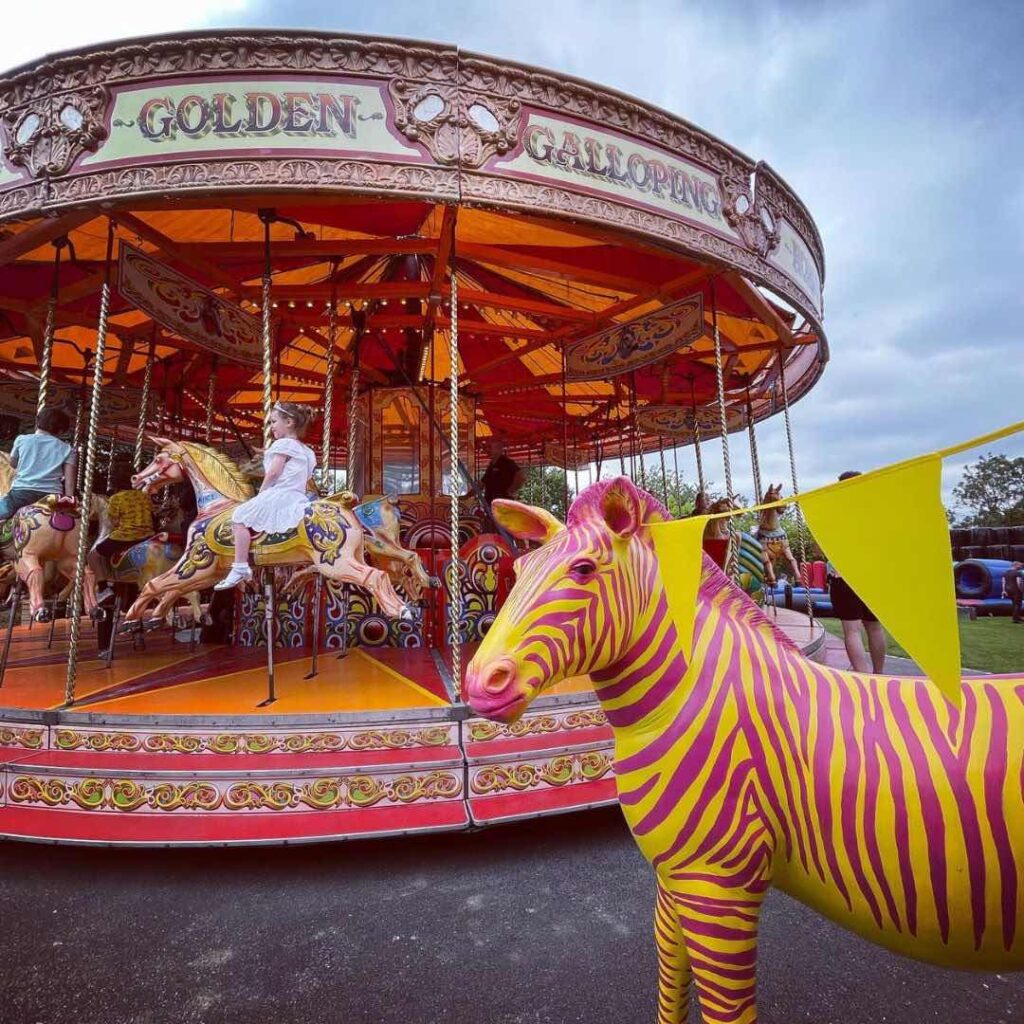Carousel fairground ride at outdoor community event.