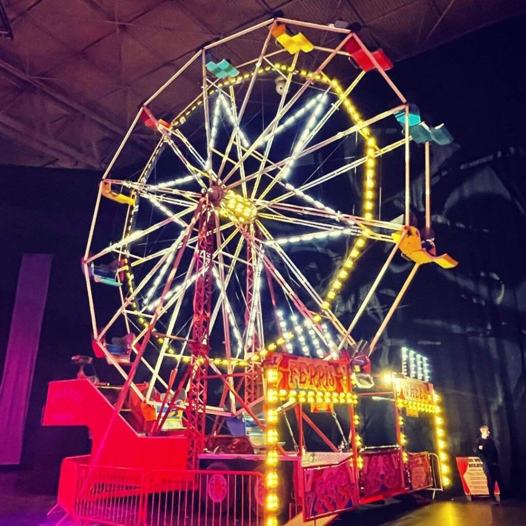 Ferris wheel fairground ride at a festival event.