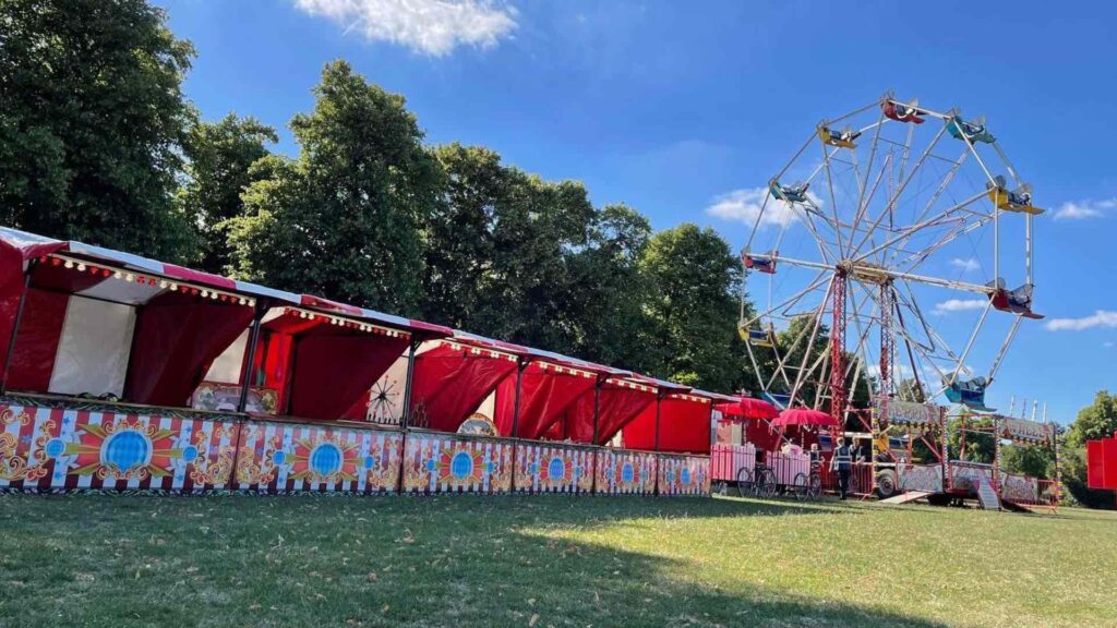 Funfair stalls in a row at a corporate festival event in the summer.