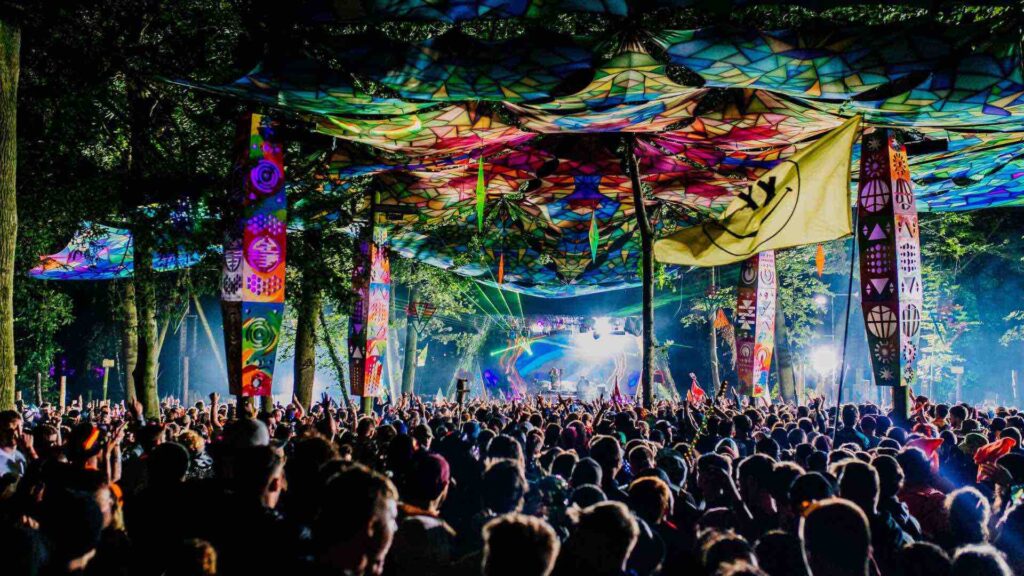 Festival event production with large stage, pyrotechnics and ceiling canopy.