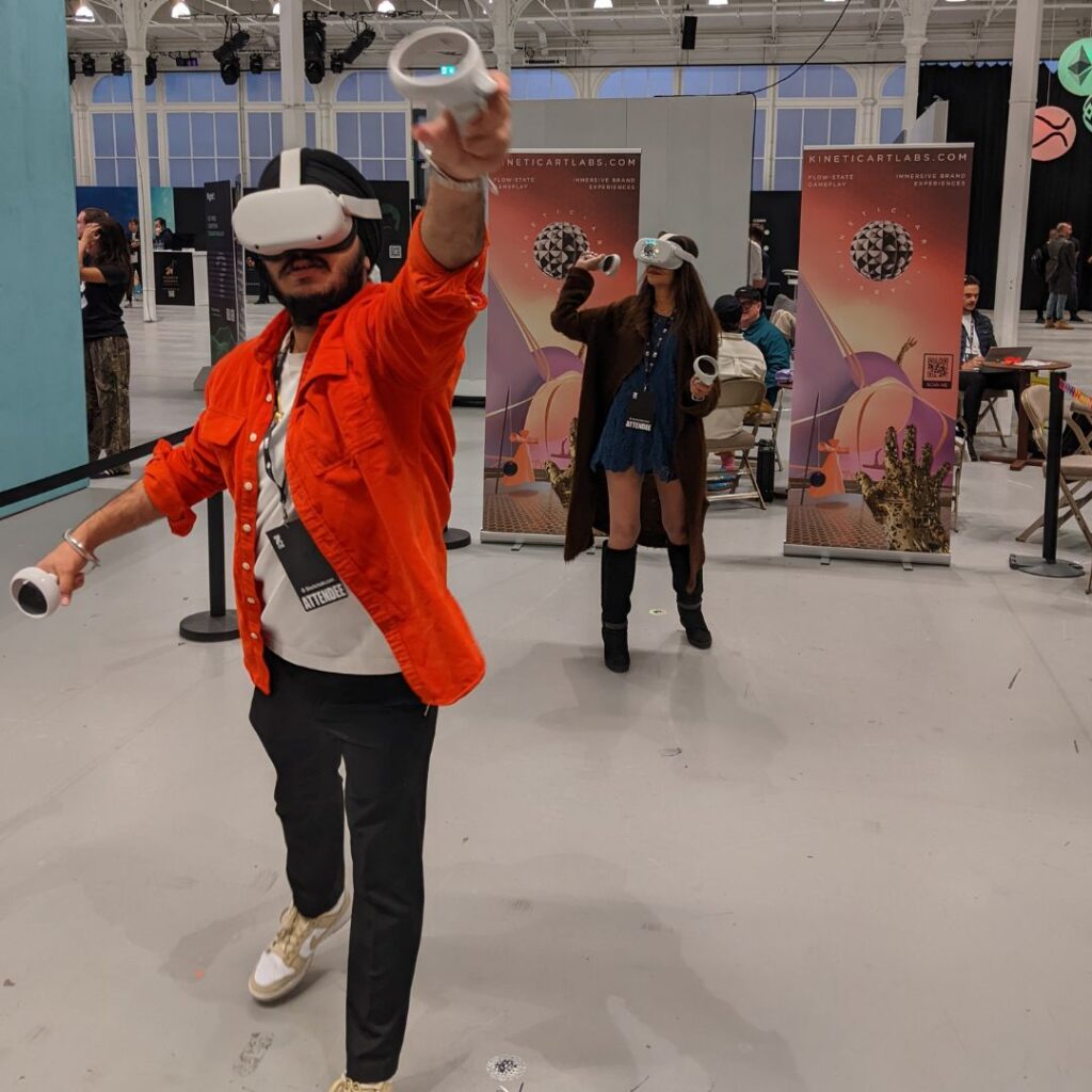Exhibition attendees interacting with virtual reality experience at an exhibition stand.