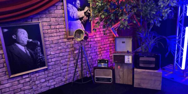 When we design an event space we consider every aspect. Here you can see a vintage Gatsby theme set up with Jazz posters, props and musical instruments.