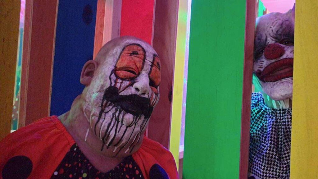 Halloween scare clown actors posing at Riyadh scare event.