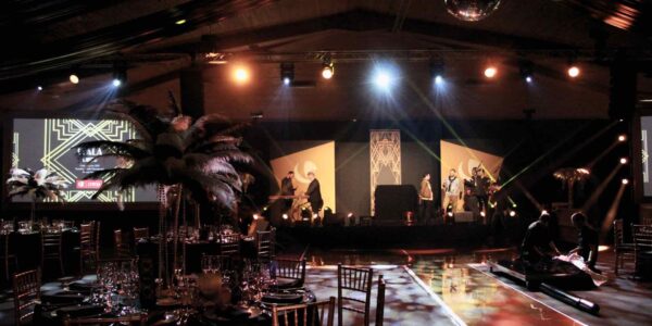 Our team applying the finishing set-up touches to a Gatsby themed event.