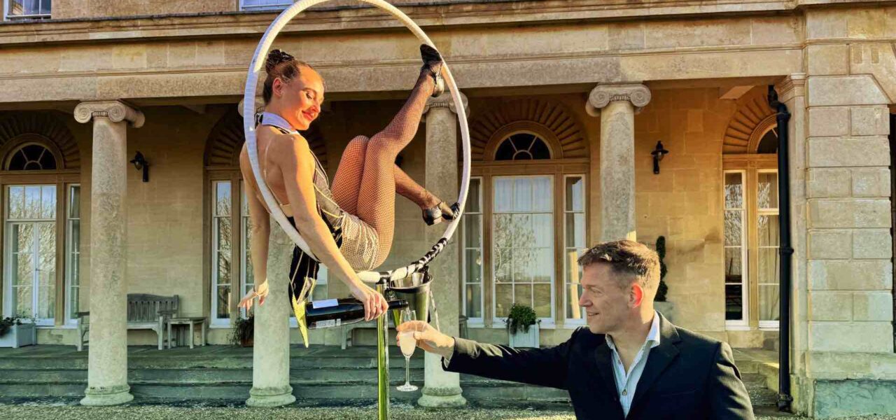 Paris-Themed-Aerialist-In-Hoop-Pouring-Champagne