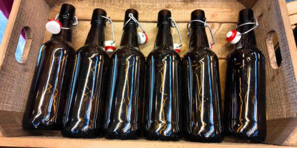 A collection of old bottles styled to look like prohibition decor from the Gatsby theme era.