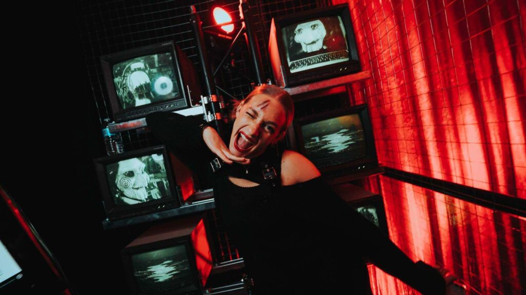 Televisions displaying SAW billy the puppet at TABU Halloween themed event.