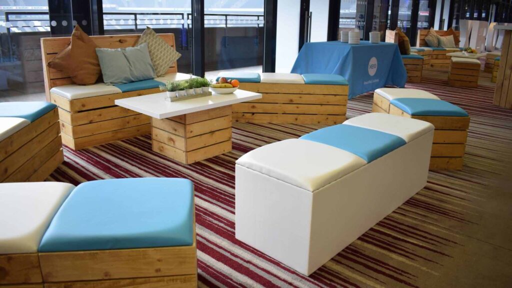 Bespoke pallet furniture ion blue and white with finishing touches used at a xero conference.