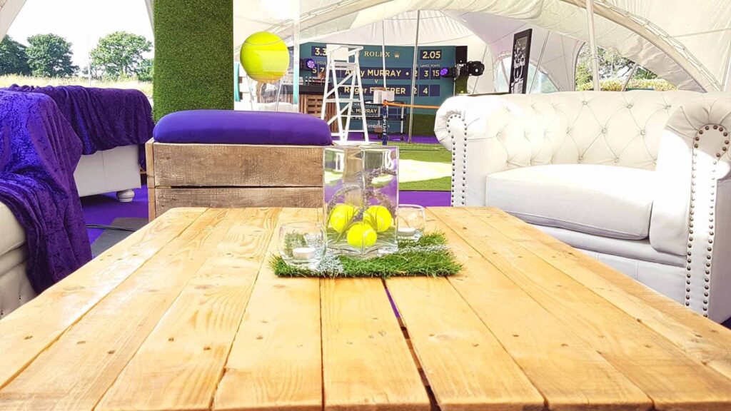 Tennis themed table decor used to enhance a pallet table.