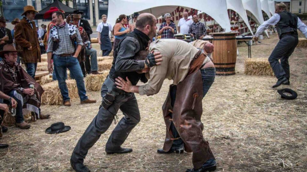 Wild West stunt show performance at family fun day event.
