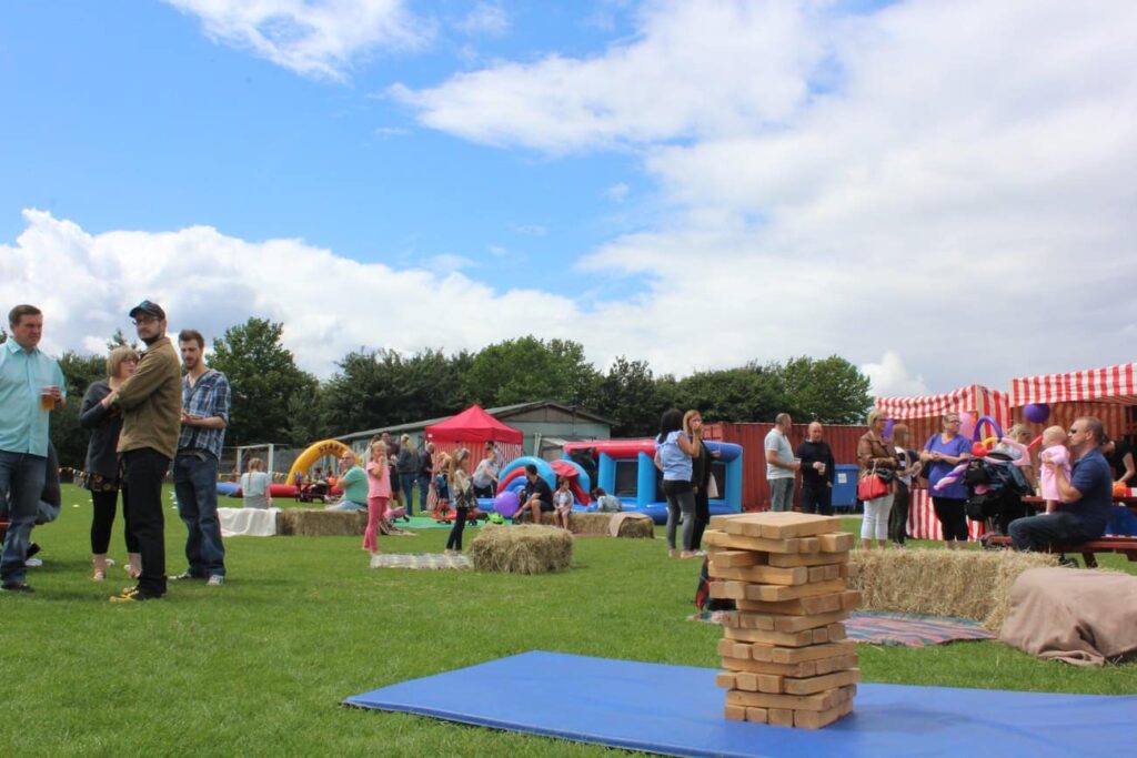 Amazon corporate fun day with wild west theme and props with outdoor activities.