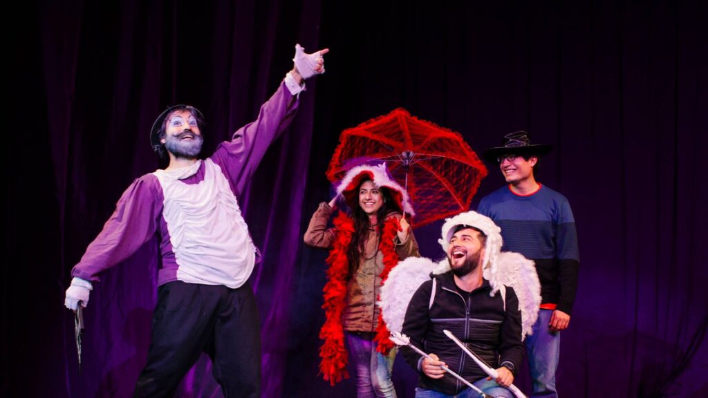 Comedian and audience members performing on stage.