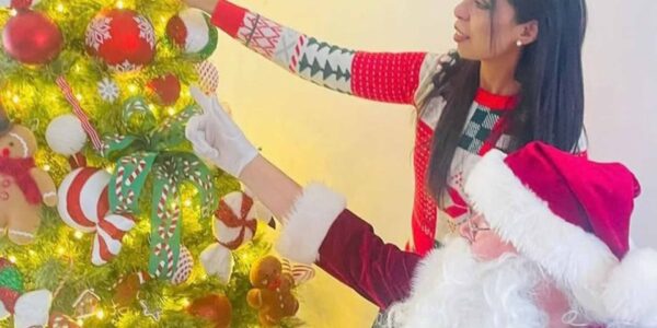 Father-Christmas-Performer-Decorating-Christmas-Tree