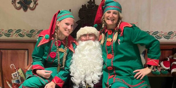 Father-Christmas-Performer-Posed-With-Elves