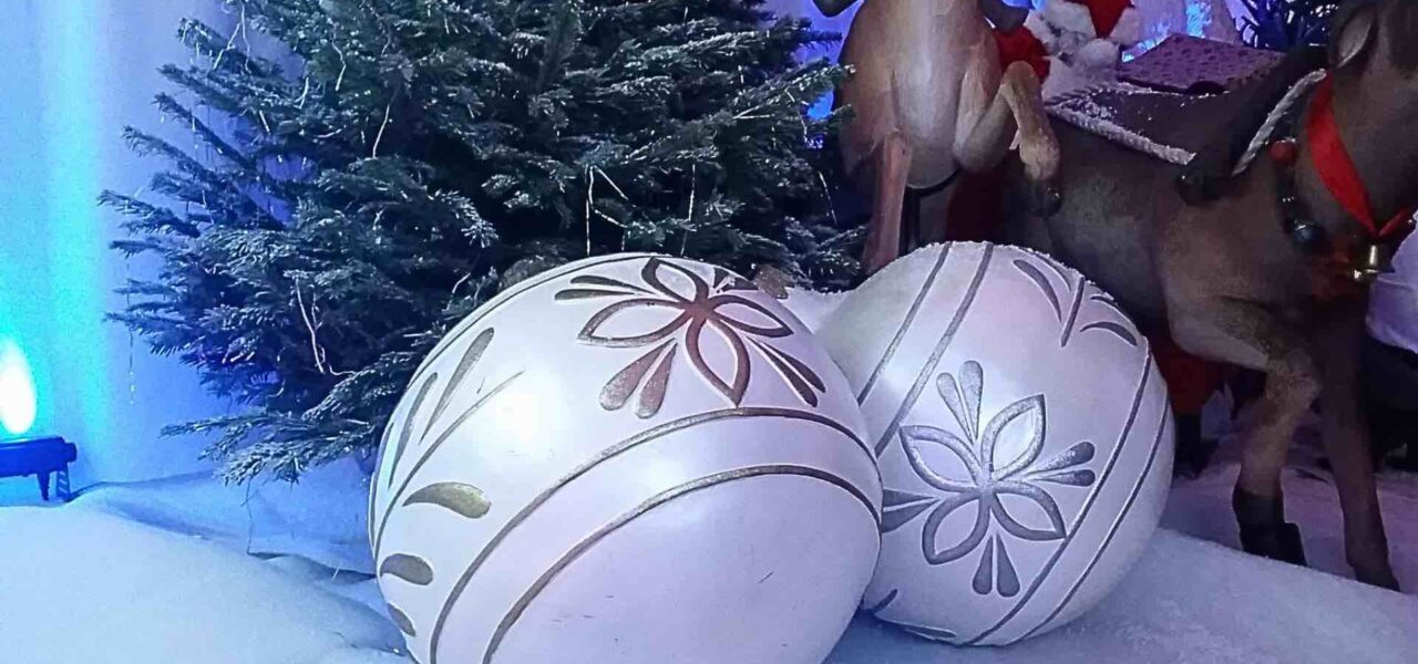 Giant Christmas Baubles in silver with classic Christmas theming.