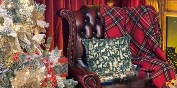 Intricate and cosy grotto theming for Christmas theming in an office.