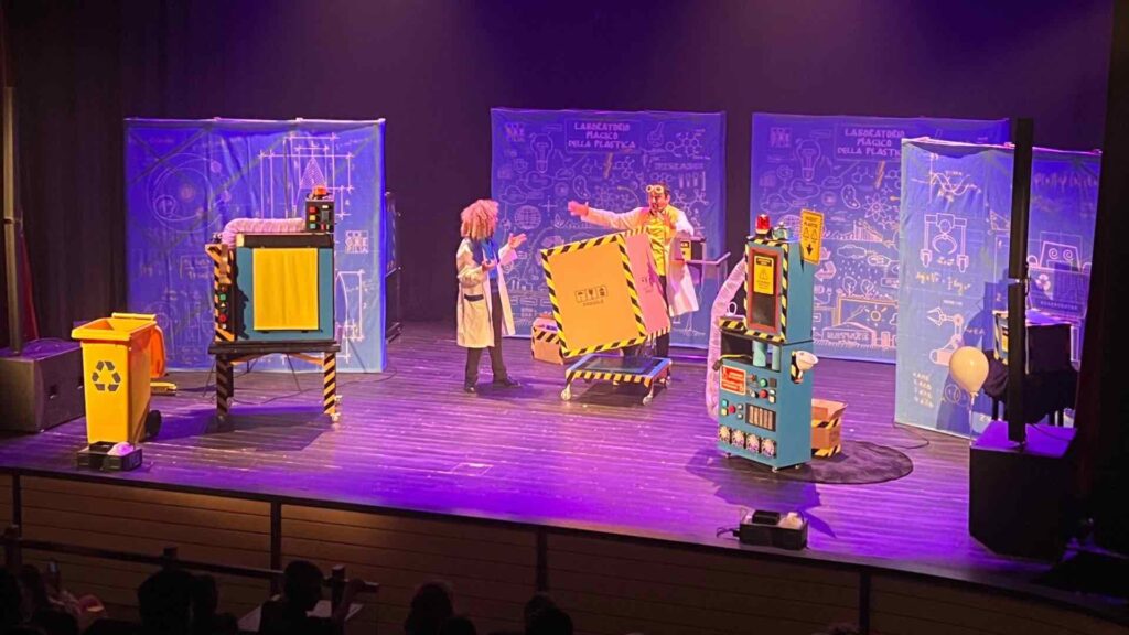 Magic lab science show performance on stage incorporating a range of props.