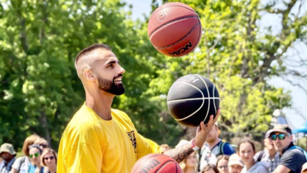 Multi Freestyler juggling basketballs.