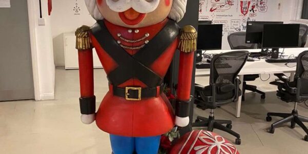 Nutcracker and baubles Christmas decorations used by Christmas party event planners for office Mastercard makeover.
