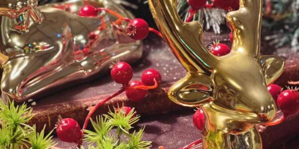 Gold reindeer Christmas decorations used by Christmas theming professionals for office decor.