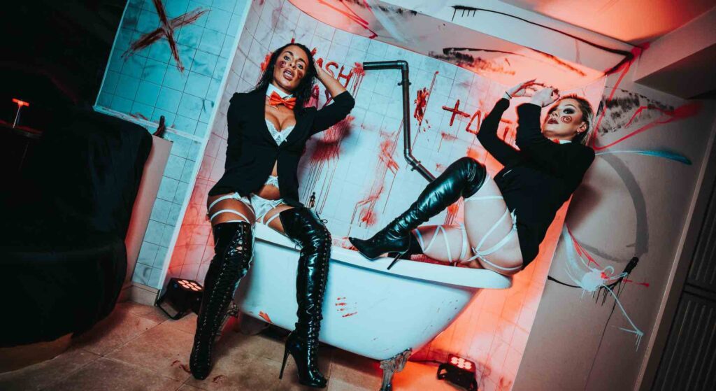Ladies posing on bathtub from SAW movie event designed for London TABU nightclub.