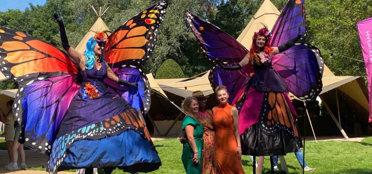 Butterfly-Stiltwalkers-With-Guests
