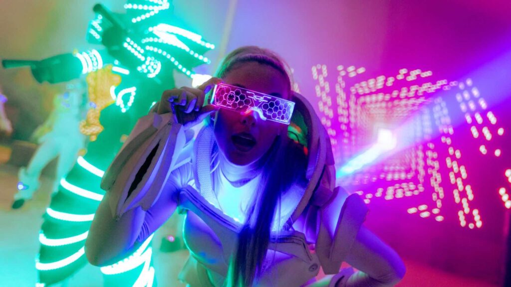 LED dancer posing for the camera at corporate festival event.