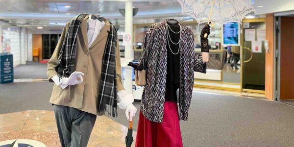 Headless-Couple-Under-Umbrella-At-Event