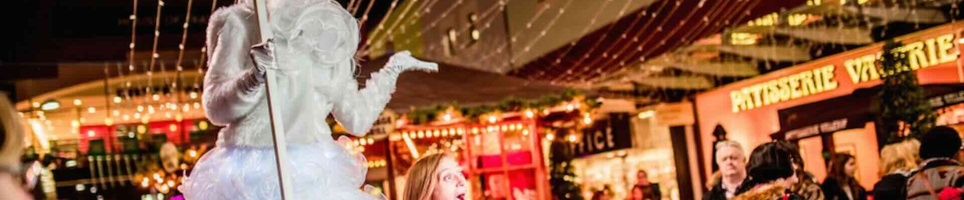Ice-Queen-Stilt-Walker-Towering-Over-Crowd Ice-Queen-Stilt-Walker-Towering-Over-Crowd