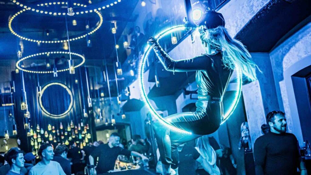 Led Hoop Aerial Performer hanging at a club
